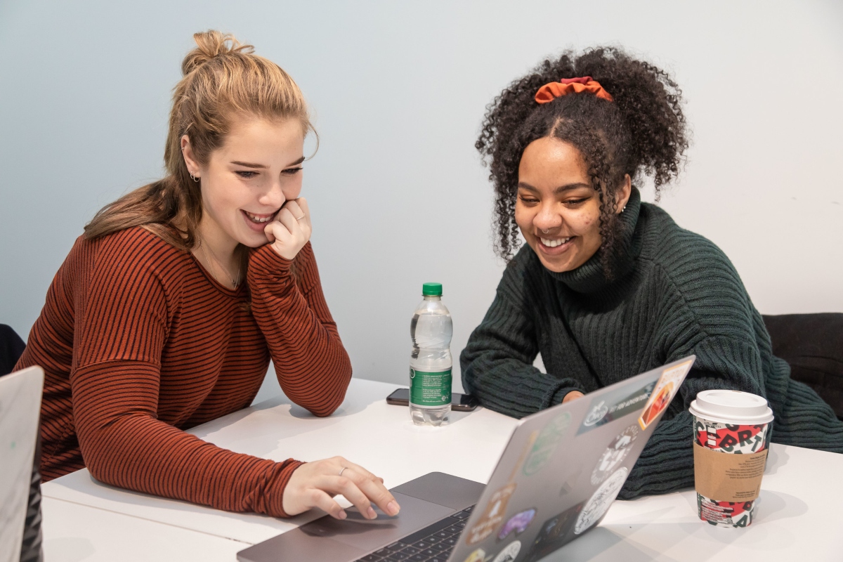 Students at a laptop.