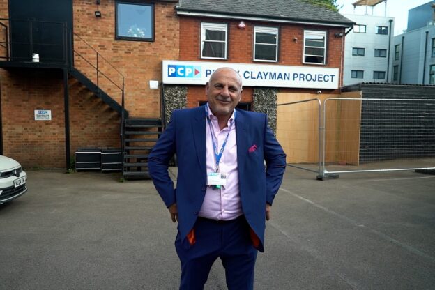 Andy Kalli standing with his hand in his pocket in front of PCP rehab centre in Luton